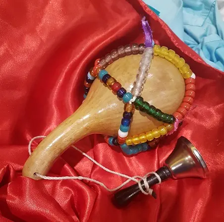 Asson2 — An asson, the sacred rattle emblematic of thepriesthood of Haitian Vodou. It is made of a calabash gourd, strung with beads and / or snake vertebrae.