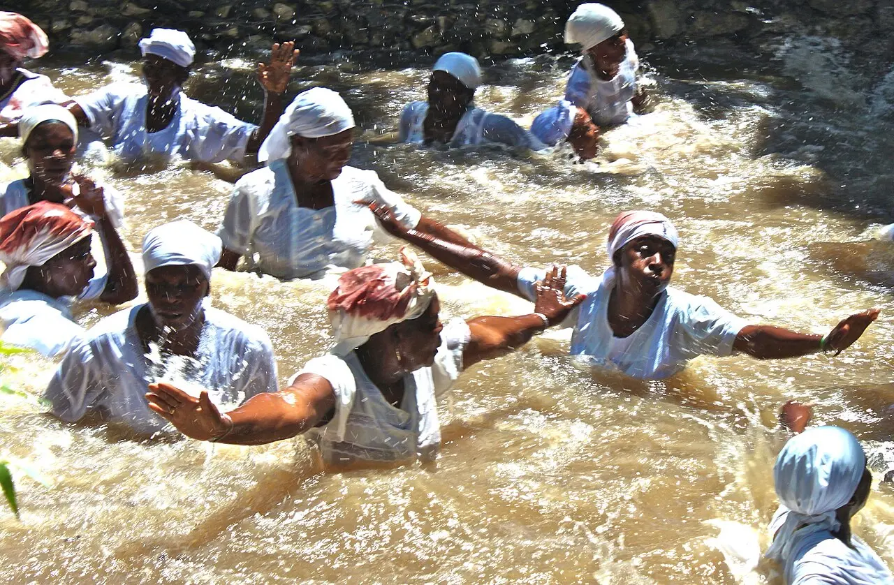 Cleaning their sins — After the sacrifice, the people wash away their sins in a pool of mud, voodoo Ceremony, La souvenance Gonaives
