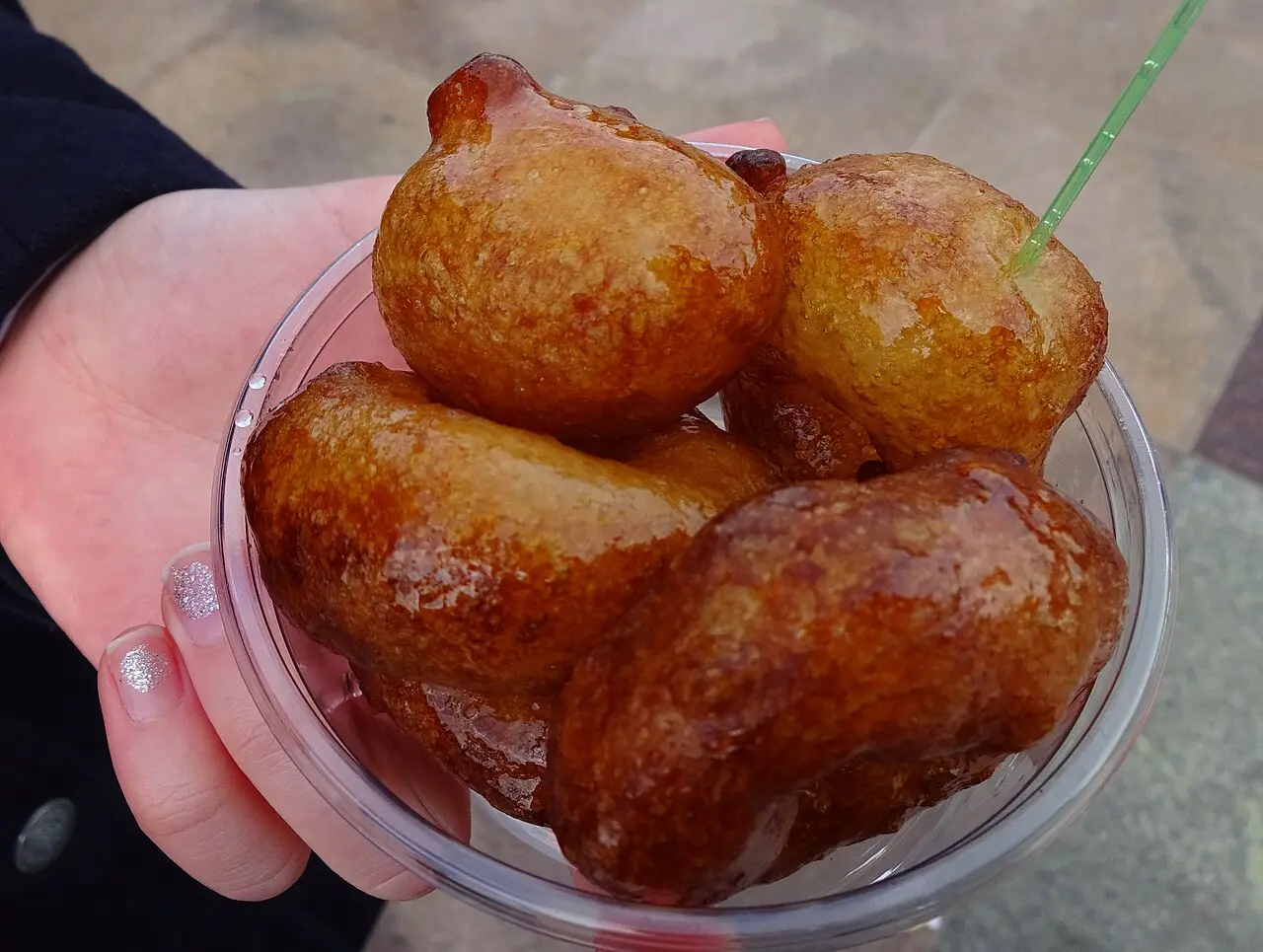 Lokma Galata Bridge — Lokma, dough balls, fried and doused with sugar syrup. Sold next to the Galata Bridge in Istanbul in plastic cups as street food.